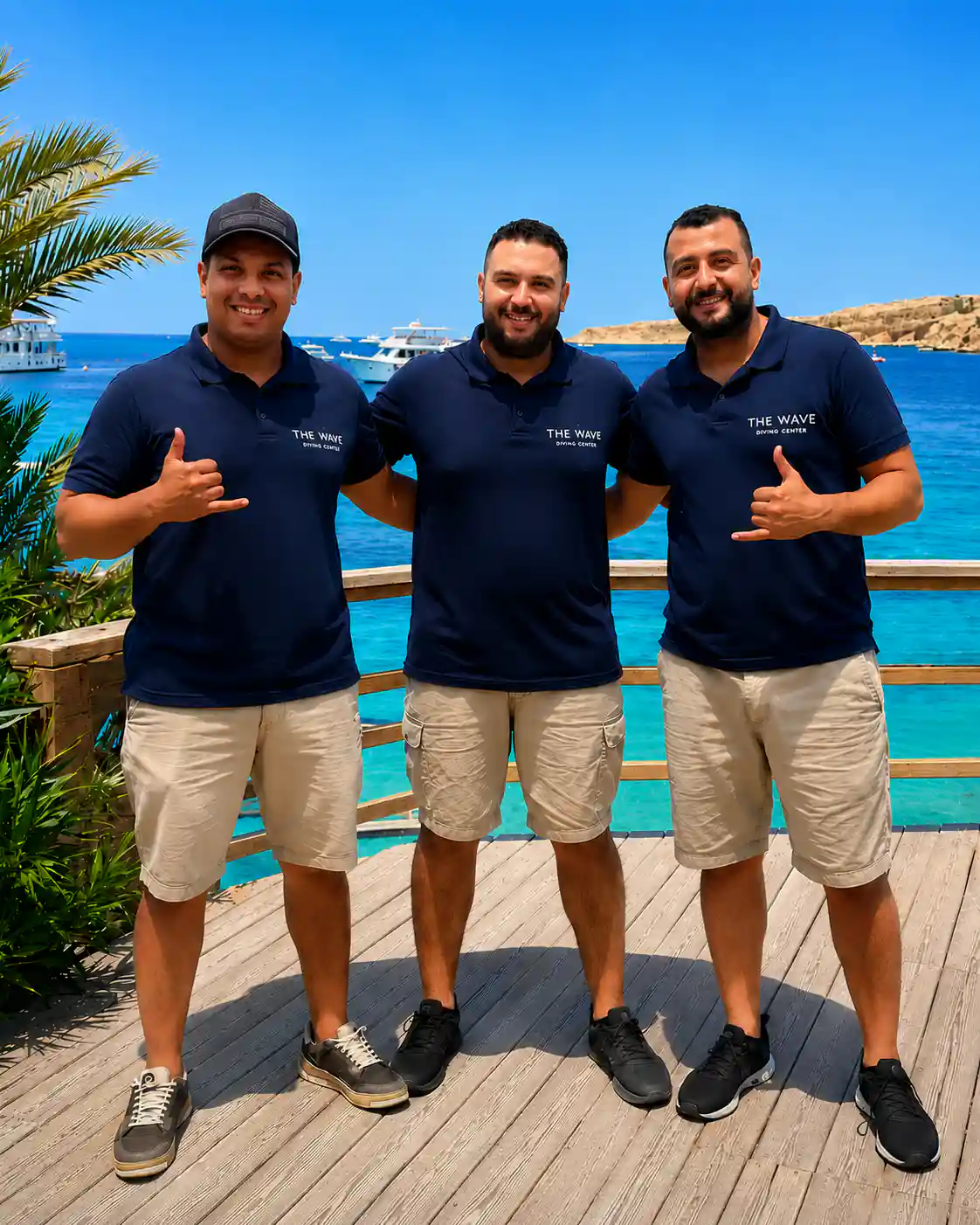 The three founders of The Wave Diving Center on the deck by the Red Sea